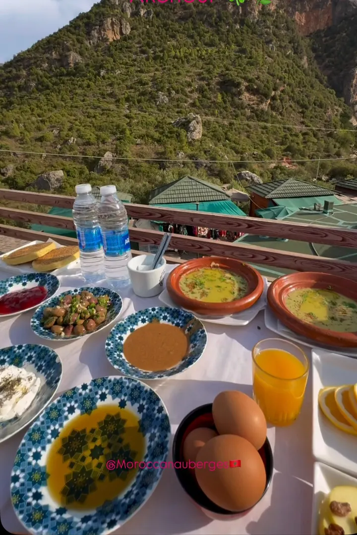 Moroccan breakfast spread on a terrace facing the mountain